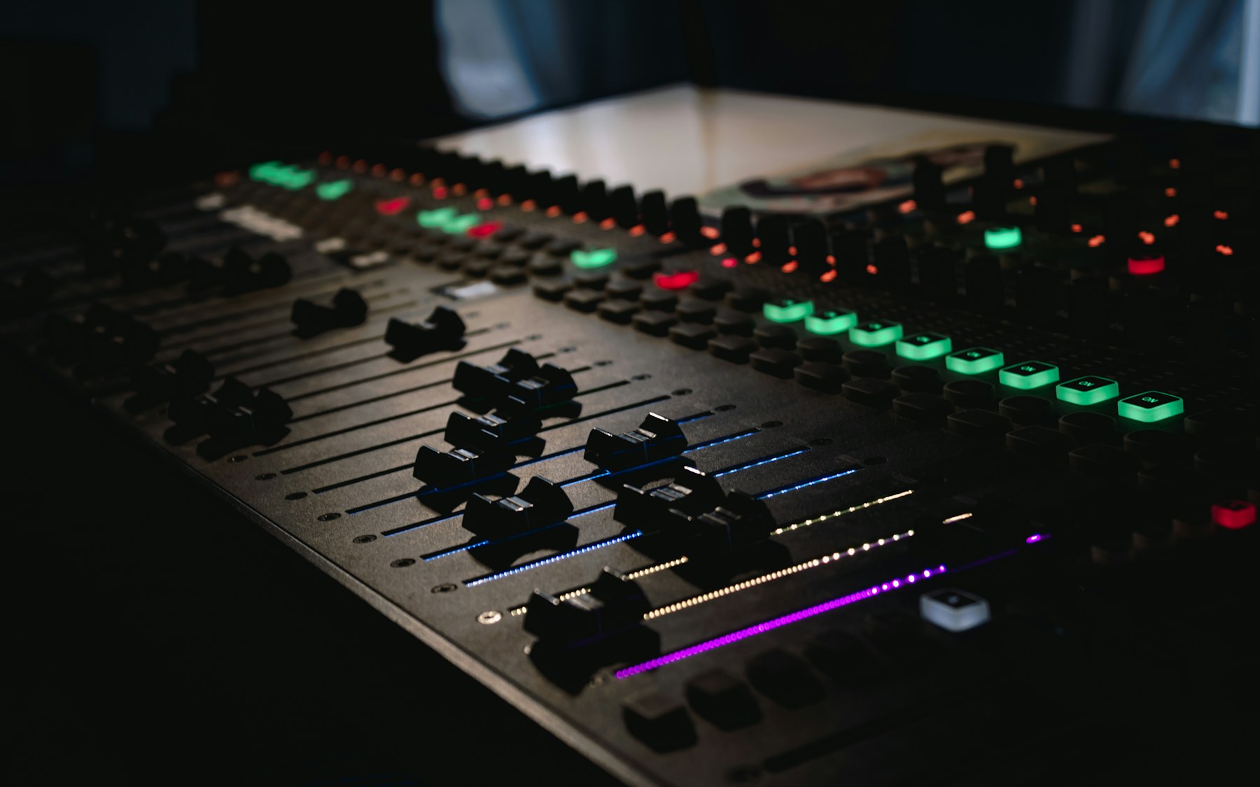 Close view of controls on a professional audio mixer