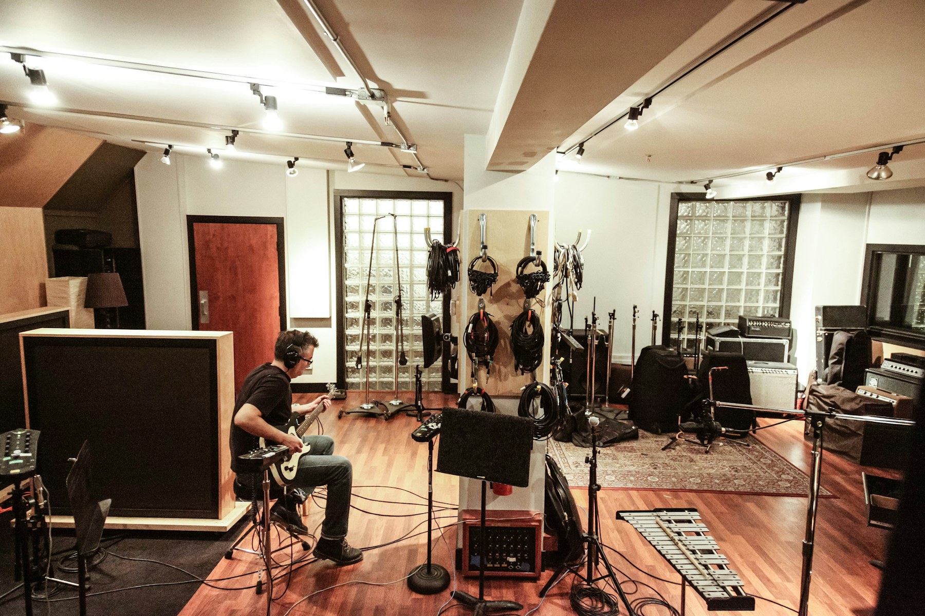 Musicians playing instruments together in a studio room